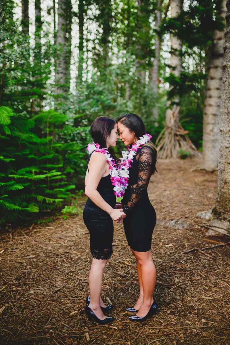 Two brides doing "ha" breath in ceremony